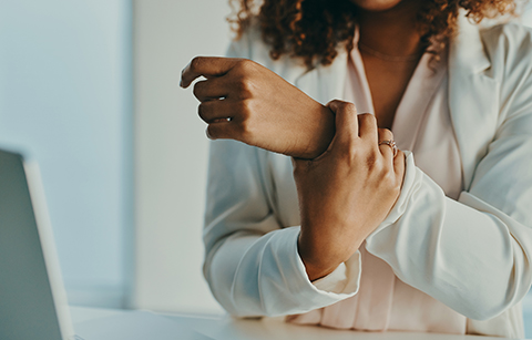 woman holding wrist